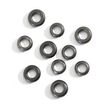Load image into Gallery viewer, Set di 10 componenti rondelle in titanio con riflessi naturali e metallici, dettaglio della superficie liscia.