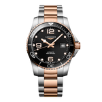 Load image into Gallery viewer, Quadrante nero a raggi di sole con numeri arabi e indici applicati, lancette rosa con trattamento Swiss Super-LumiNova® dell'orologio Longines HydroConquest automatico