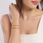 Load image into Gallery viewer, Bracciale dorato con ciondolo quadrifoglio
