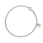 Load image into Gallery viewer, Bracciale Bollicine DoDo in argento 925 con piastrine in oro rosa 9K, design fresco e luminoso.
