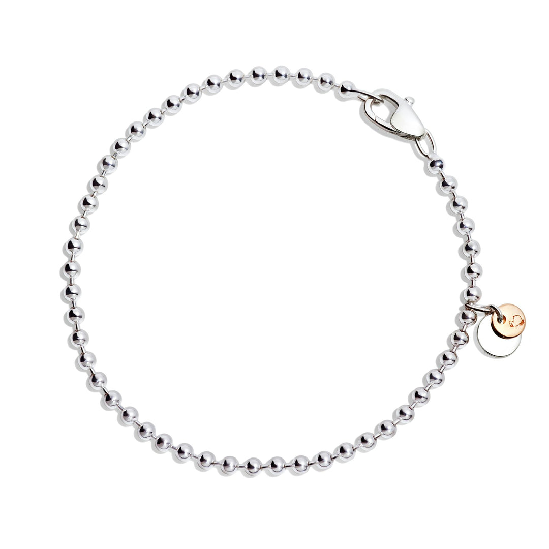 Bracciale Bollicine DoDo in argento 925 con piastrine in oro rosa 9K, design fresco e luminoso.
