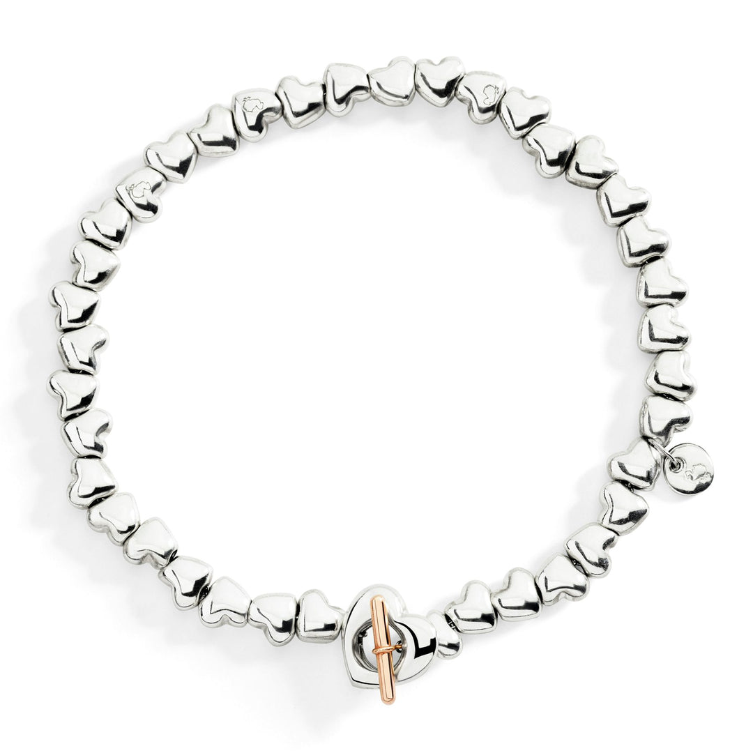 Bracciale Cuore DoDo in argento 925 con chiusura t-bar in oro rosa 9K, catena in argento 925 e anello brisé in acciaio.