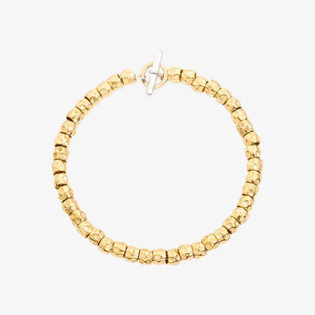 Bracciale Granelli DoDo in argento 925 con anello brisè in oro giallo 18K, design organico e naturale.