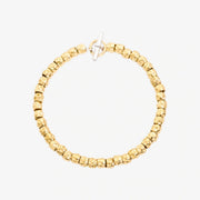 Bracciale Granelli DoDo in argento 925 con anello brisè in oro giallo 18K, design organico e naturale.