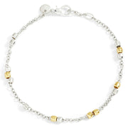 Bracciale Mini Granelli DoDo in argento 925 e oro giallo 18K, design ispirato ai granelli di sabbia.