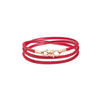 Load image into Gallery viewer, Bracciale Nodo Damiano Parati in oro rosa 9K con cordino in pelle rossa, design elegante e moderno.
