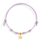 Load image into Gallery viewer, Bracciale Pad Mini Stellina DoDo con charm stellina in oro giallo 18K, mini granelli in argento e oro, cordino lilla regolabile.
