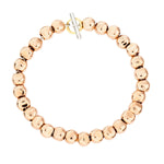 Load image into Gallery viewer, Bracciale Pepita DoDo in oro rosa 9K e argento 925 con anello brisè in oro giallo, design ispirato a pietre levigate dal mare.
