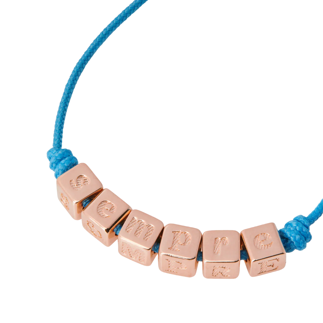 Bracciale Sempre DoDo con cordino blu e scritta "SEMPRE" in argento dorato oro rosa 18K, simbolo di amore e continuità.