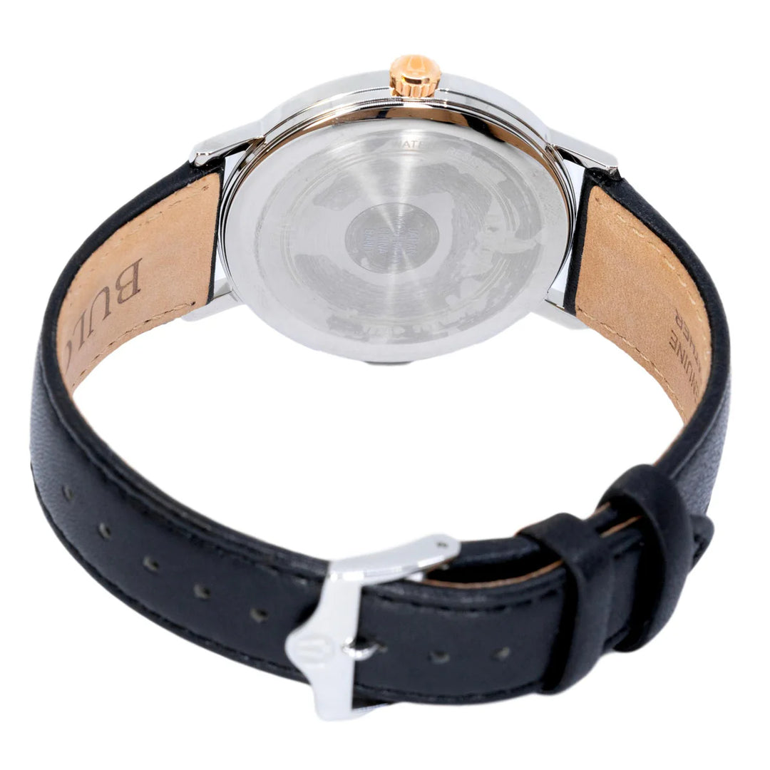 Quadrante con indici e lancette oro rosa con punti luminosi.