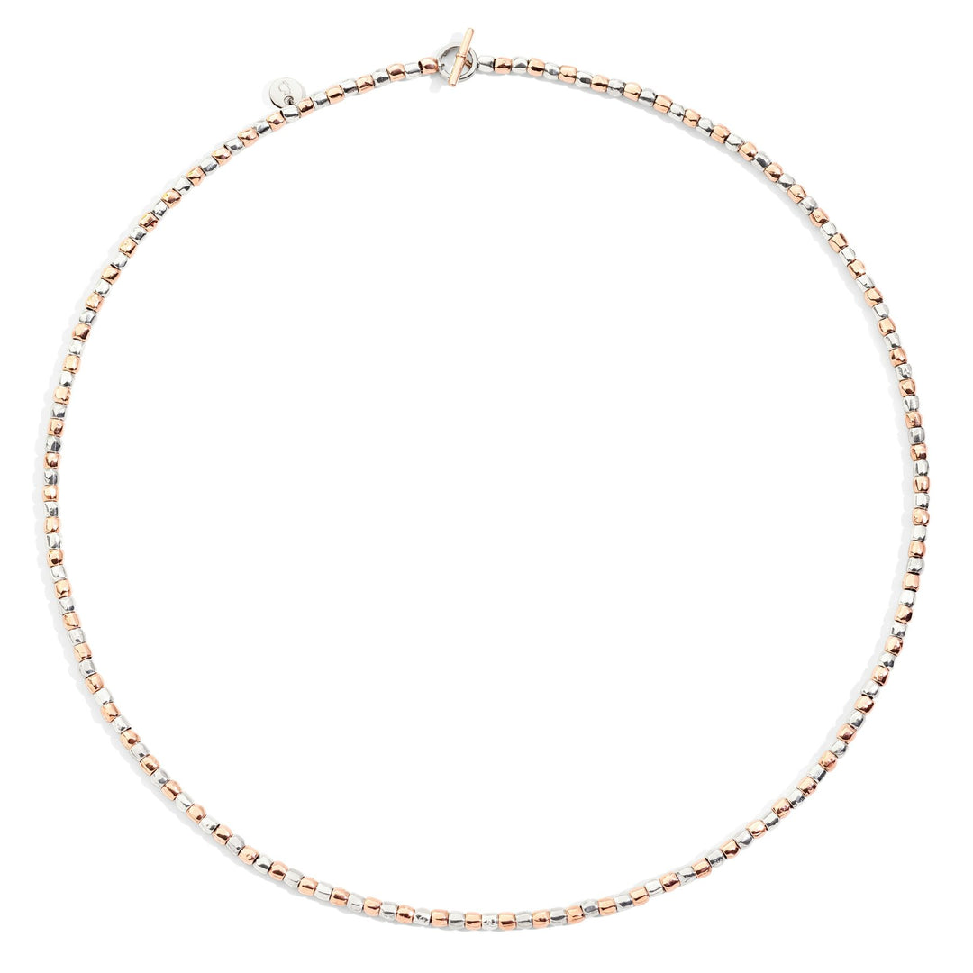 Collana Mini Granelli DoDo in argento 925 e oro rosa 9K con minigranelli e chiusura a barra T, design leggero e naturale.