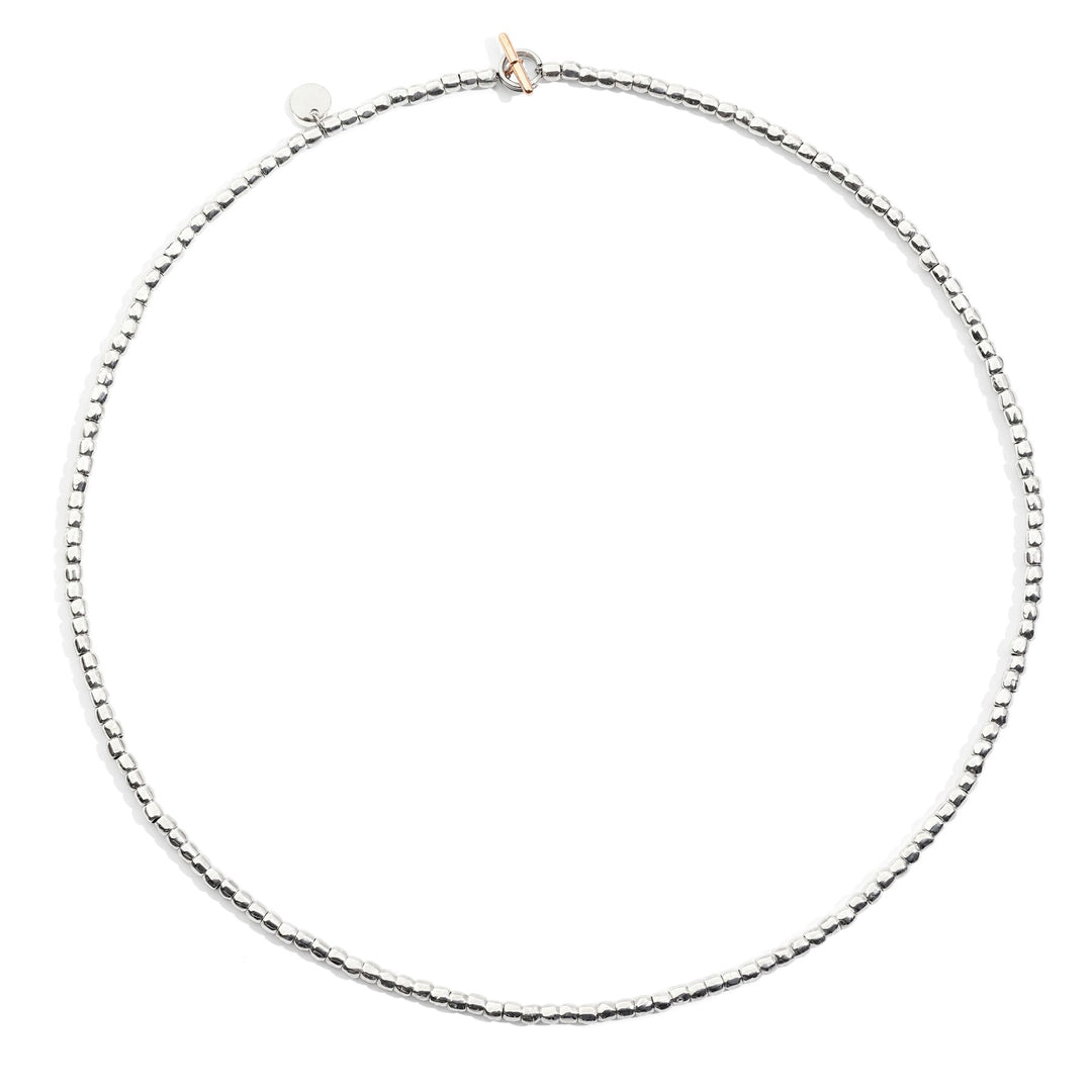 Collana Mini Granelli DoDo in argento 925 con catena e anello brisé in acciaio e t-bar in oro rosa 9K.