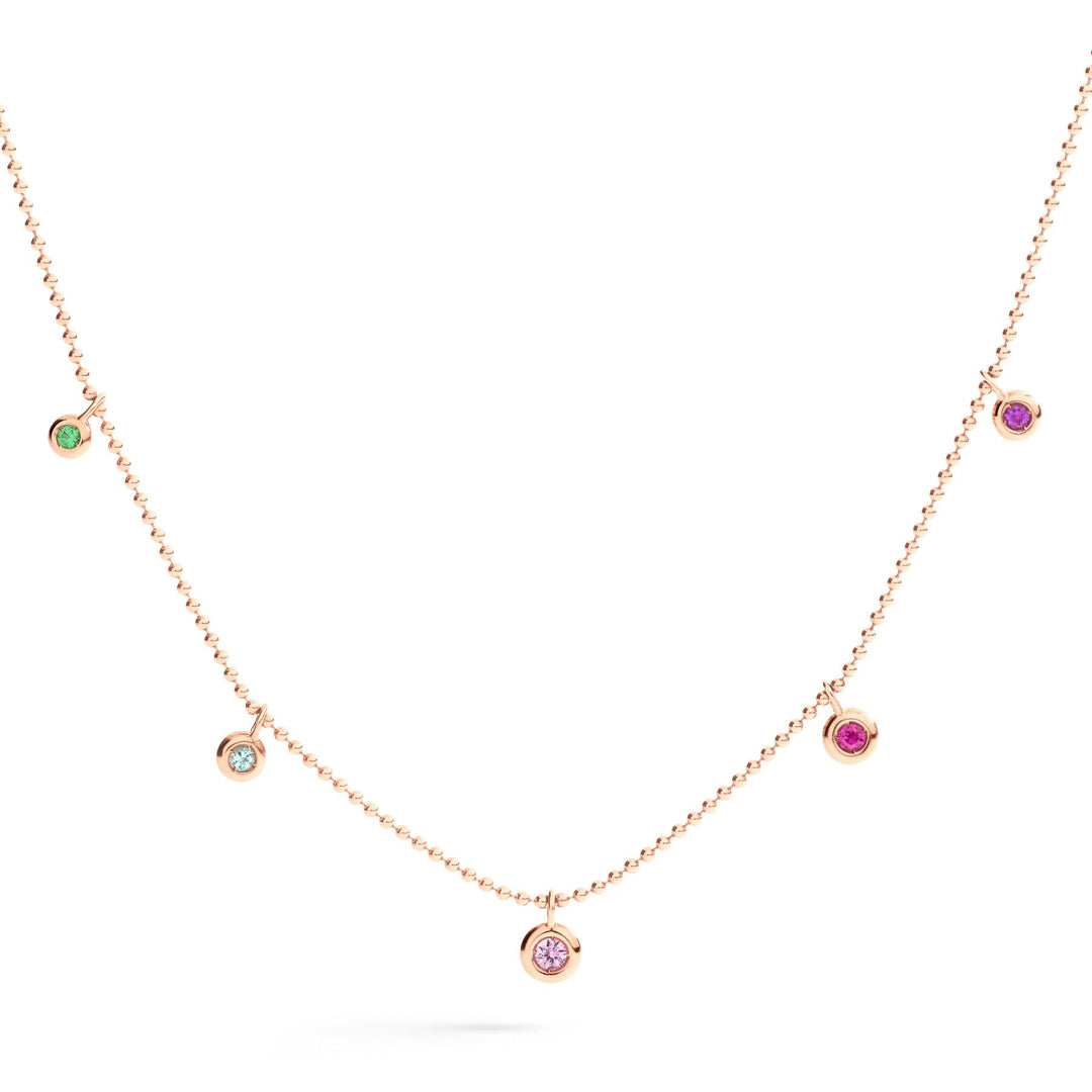 Gioiello collana unisex in oro rosa con mix di pietre colorate, simbolo di eleganza e stile vibrante.