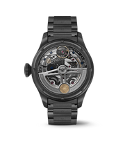 Quadrante nero opaco con indici grigi luminescenti e complicazioni calendario perpetuo.