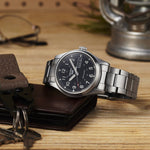 Load image into Gallery viewer, Fondello trasparente a vite in acciaio del Seiko 5 Sports SRPG27K1 con movimento automatico calibro 4R36, riserva di carica di circa 41 ore e impermeabilità fino a 10 bar
