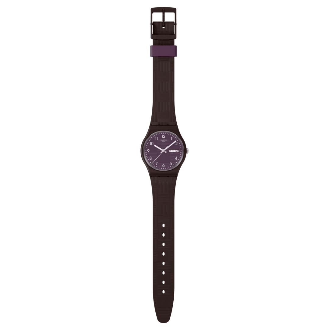Vista frontale dell’orologio Swatch Weaving Wonders SO28C700 con quadrante viola e lancette colorate, perfetto per uso quotidiano.