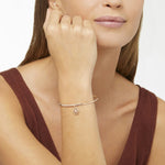 Load image into Gallery viewer, Immagine del ciondolo fiocco di neve oro rosa e diamante su sfondo neutro, accessorio elegante e simbolico.
