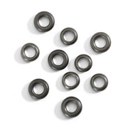 Set di 10 componenti rondelle in titanio con riflessi naturali e metallici, dettaglio della superficie liscia.