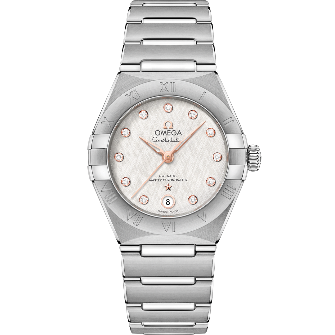 Quadrante argentato effetto cristallo dell’Omega Constellation 29 mm con indici a diamanti, lancette e logo in oro Sedna 18K, datario a ore 6